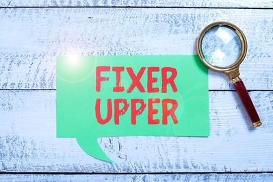 Fixer Upper text next to magnifying glass
