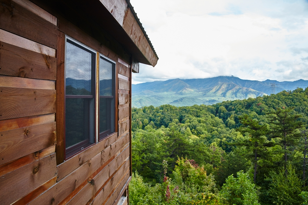 log cabin with smoky mountain view